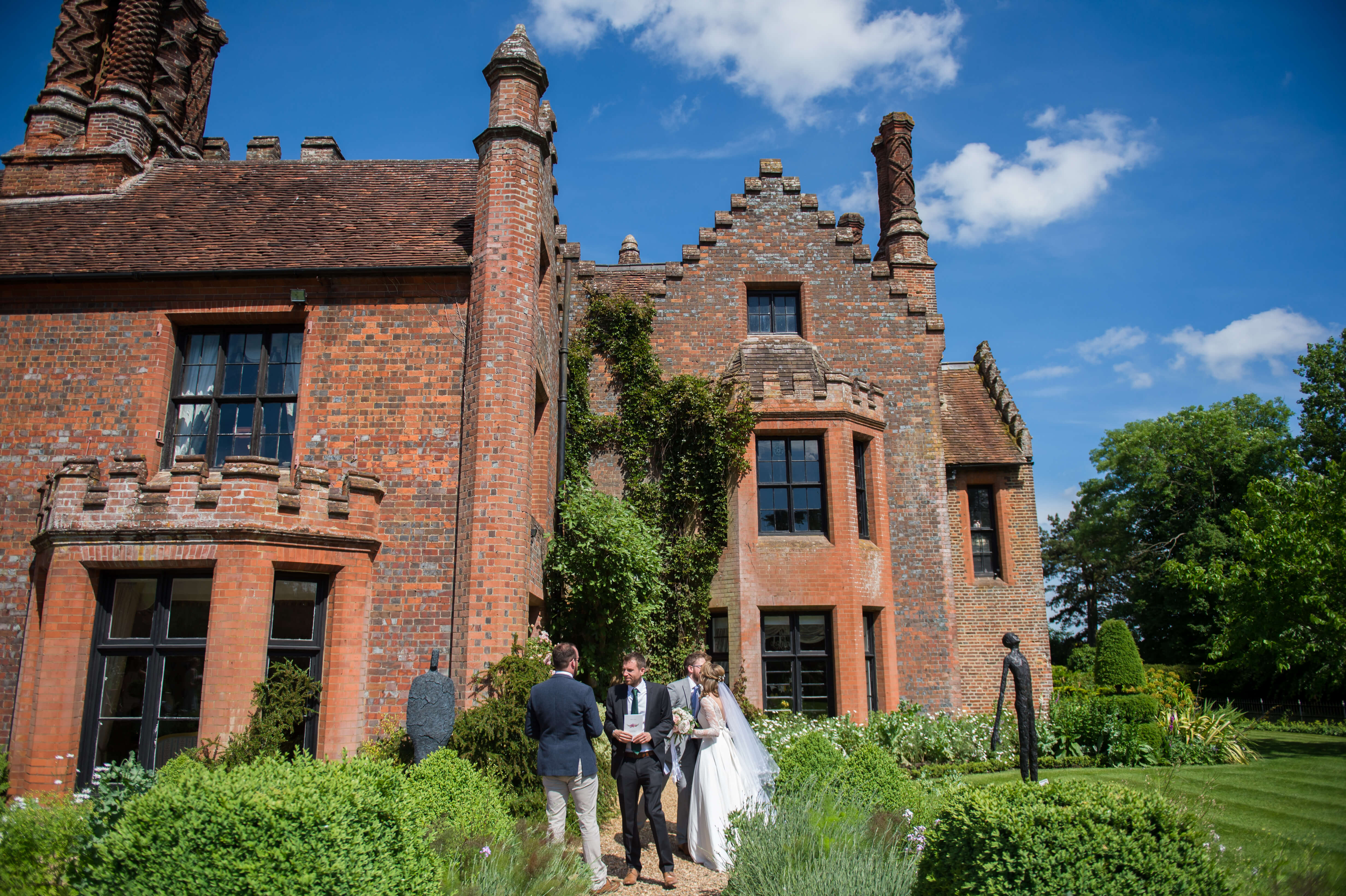 An exterior shot of beautiful chenies manor with blue skies